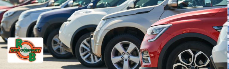 A customer browsing through a lineup of used SUVs for sale at R&B Car Company Warsaw.