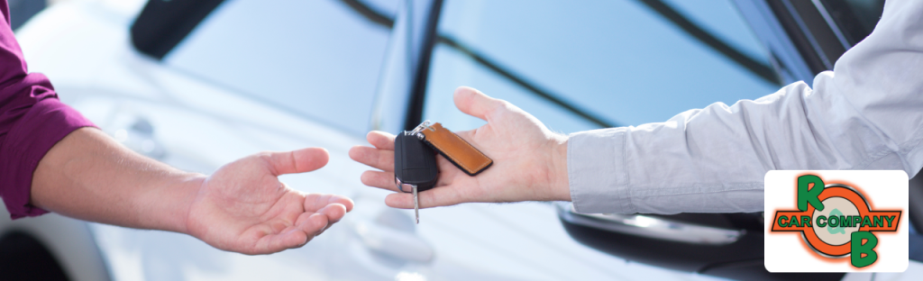 Customer reviewing a car listing at one of the top Elkhart used car dealerships