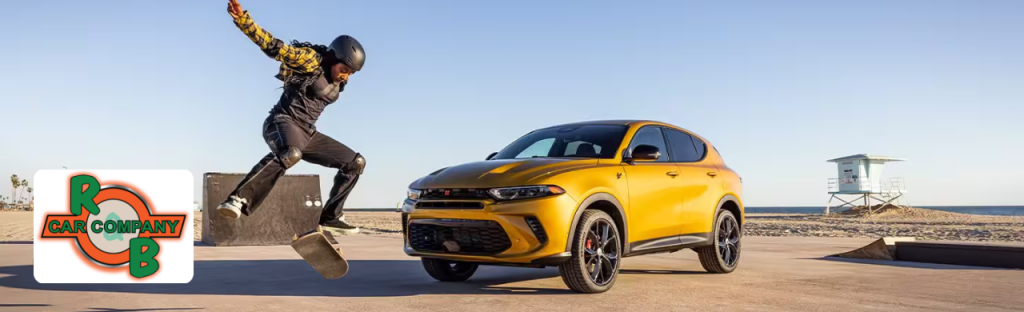 A customer exploring used Dodge cars at a Warsaw Dodge dealership.