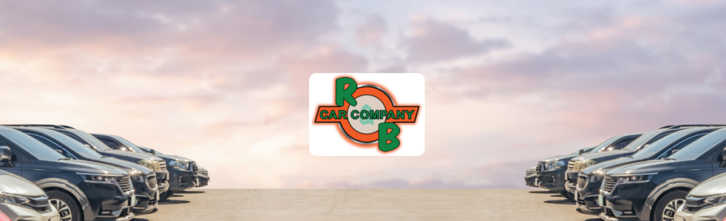 Sales representative assisting a customer in selecting a pre-owned vehicle at R&B Auto Sales, Warsaw.