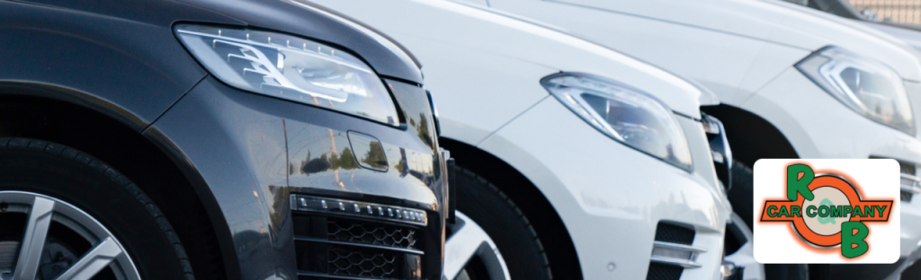 R&B Car Company Warsaw dealership lot displaying sedans, trucks, and SUVs ready for sale.