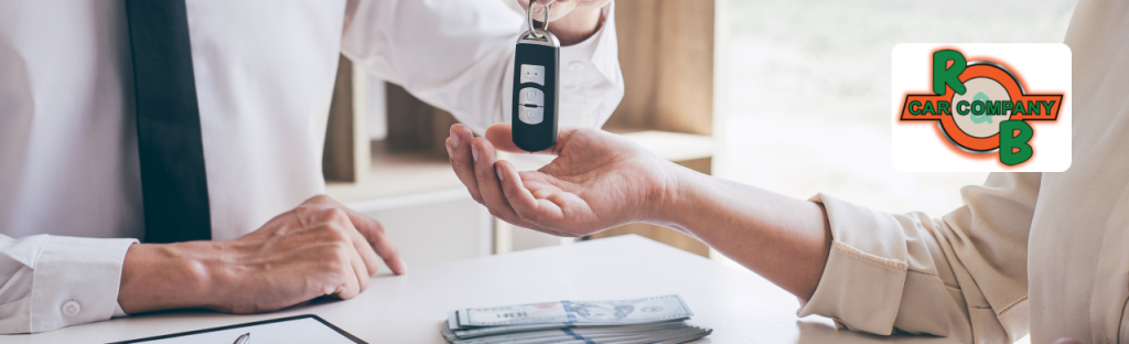 Customer is trading in a vehicle while exploring financing options for a cheap truck at the dealership.