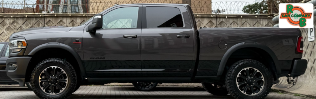 Pre-owned diesel trucks lined up for sale at R&B Car Company Warsaw dealership lot.