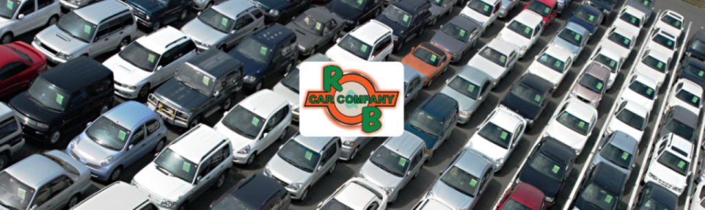 Photo showing a car owner in Warsaw, Indiana receiving a cash offer for their vehicle at R&B Car Company Warsaw.