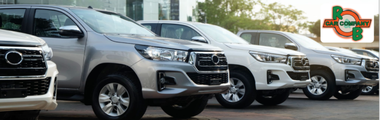 Customer browsing used cars at R&B Car Company Warsaw dealership lot.