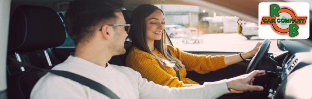 Customer test-driving a used SUV near Warsaw, Indiana, from R&B Car Company dealership.
