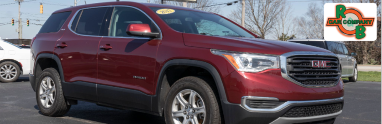 Used GMC Sierra truck parked outside R&B Car Company Warsaw, showcasing rugged utility and bold styling.